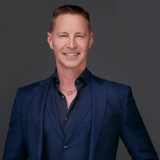 Image of Andrew Corley in a blue suit.